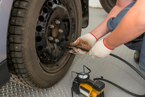 checking air pressure in tire