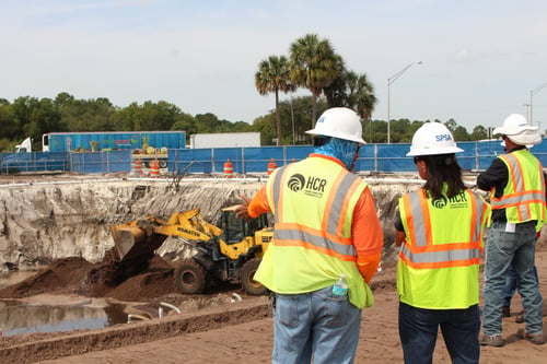 3 construction workers at construction site