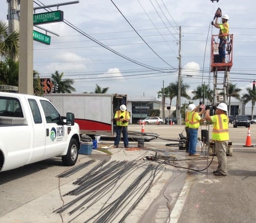 construction workers working on power lines